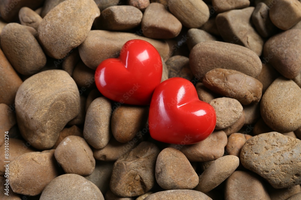 Red decorative hearts on stones, above view Red decorative hearts on stones, above view