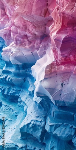 Striking geological formations with layered sediment in vivid pink, white, and blue tones photo