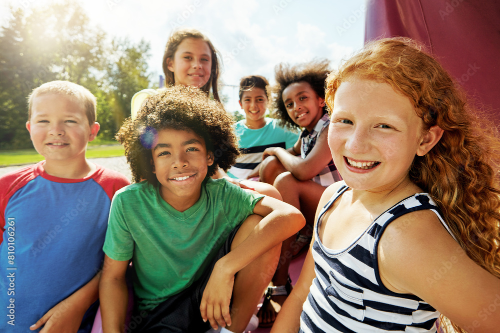 Kids, group and portrait on playground in park to relax with friends in summer on vacation. Happy, holiday and children together for camp, games or smile outdoor at middle school recess or break Kids, group and portrait on playground in park to relax with friends in summer on vacation. Happy, holiday and children together for camp, games or smile outdoor at middle school recess or break