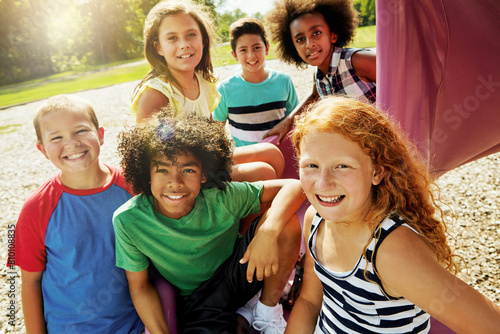 Tableau sur toile Kids, playground and portrait of group outdoor to relax with friends in summer on vacation