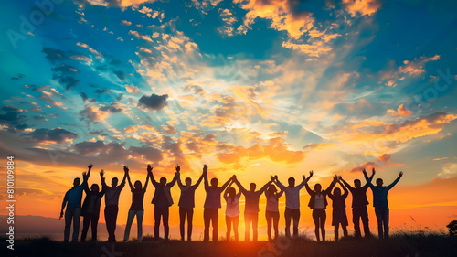 people hands up on a sunset silhouette