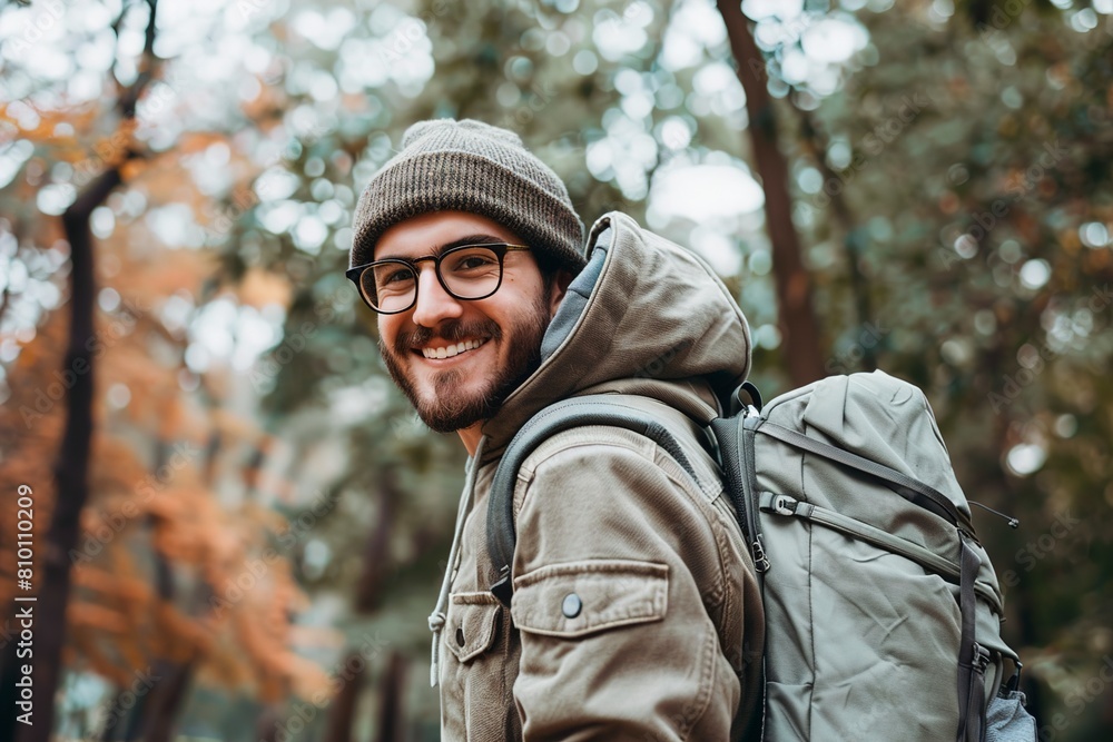 Obraz premium Happy young man carrying backpack outdoors