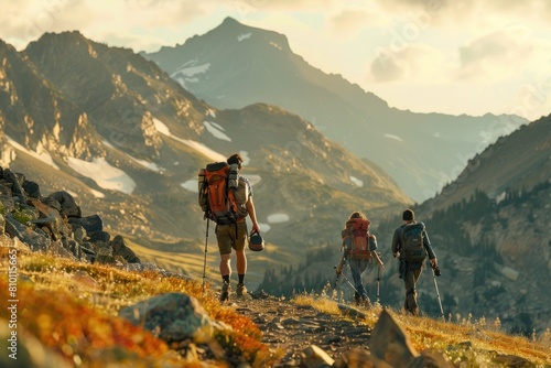 Three people are hiking up a mountain trail, with backpacks on their backs photo