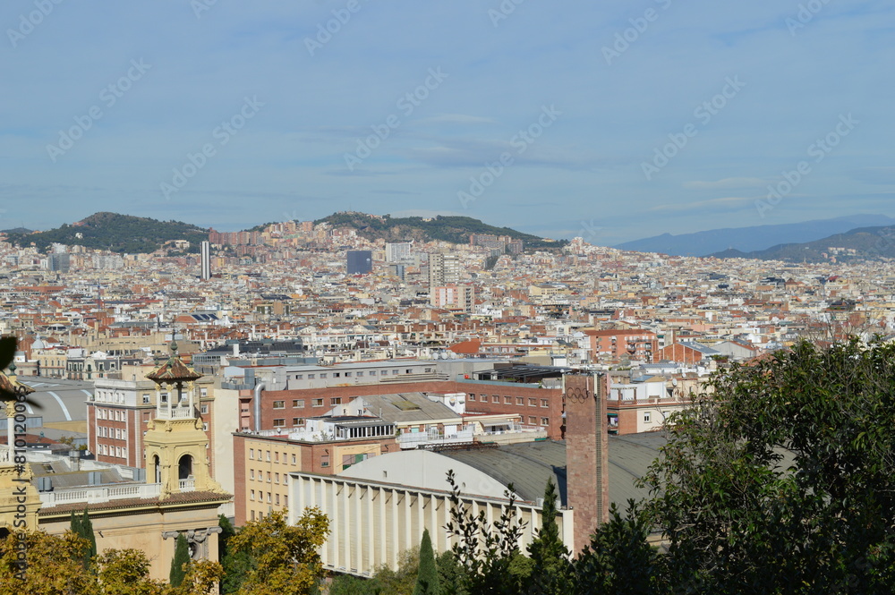 Fototapeta premium Panorma of the city of Barcelona, beautiful historical buildings and urban development - horizon and mountains - view from above, Catalonia, Spain, travel to Europe