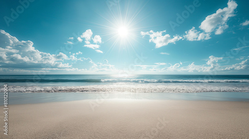 Sunny beach with gentle waves and bright blue sky, peaceful tropical landscape