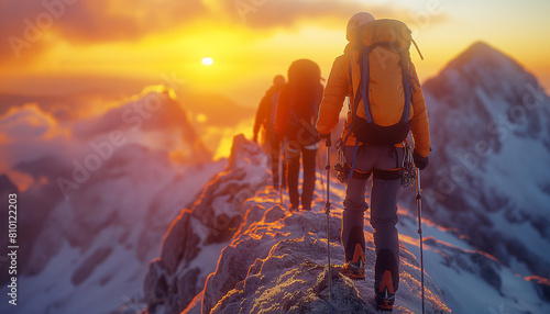 Back view of climbers with backpacks and trekking poles in crampons walking by the mountain ridge as a rope team enjoying picturesque sunset sky. Active people, high mountains expedition concept image photo