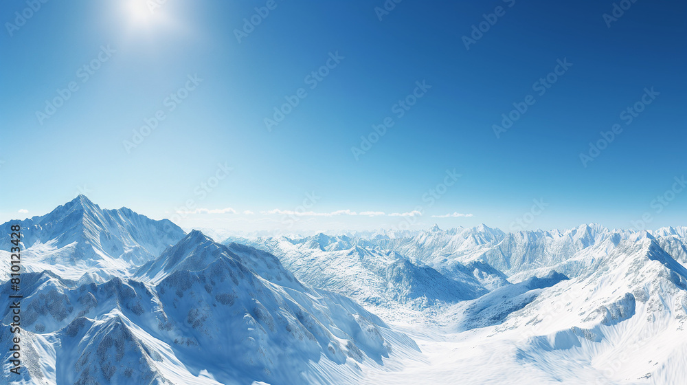 Obraz premium Snow-covered mountain range under a clear blue sky, serene winter landscape