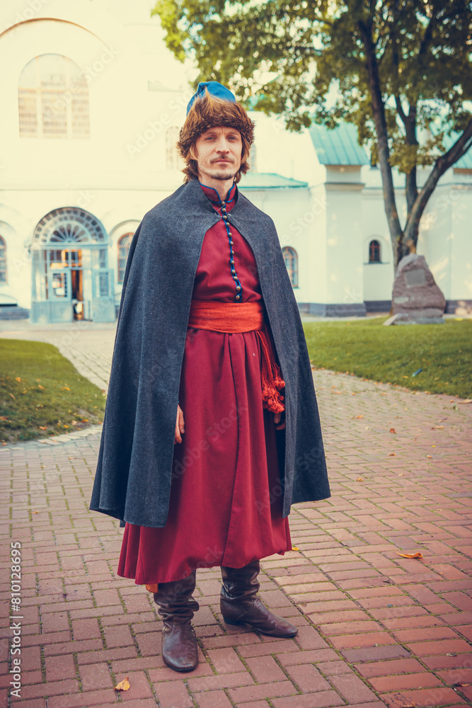 Portrait of a man in a medieval middle class costume. Retro style and historical clothes concepts