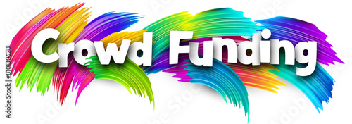 Crowd funding paper word sign with colorful spectrum paint brush strokes over white.