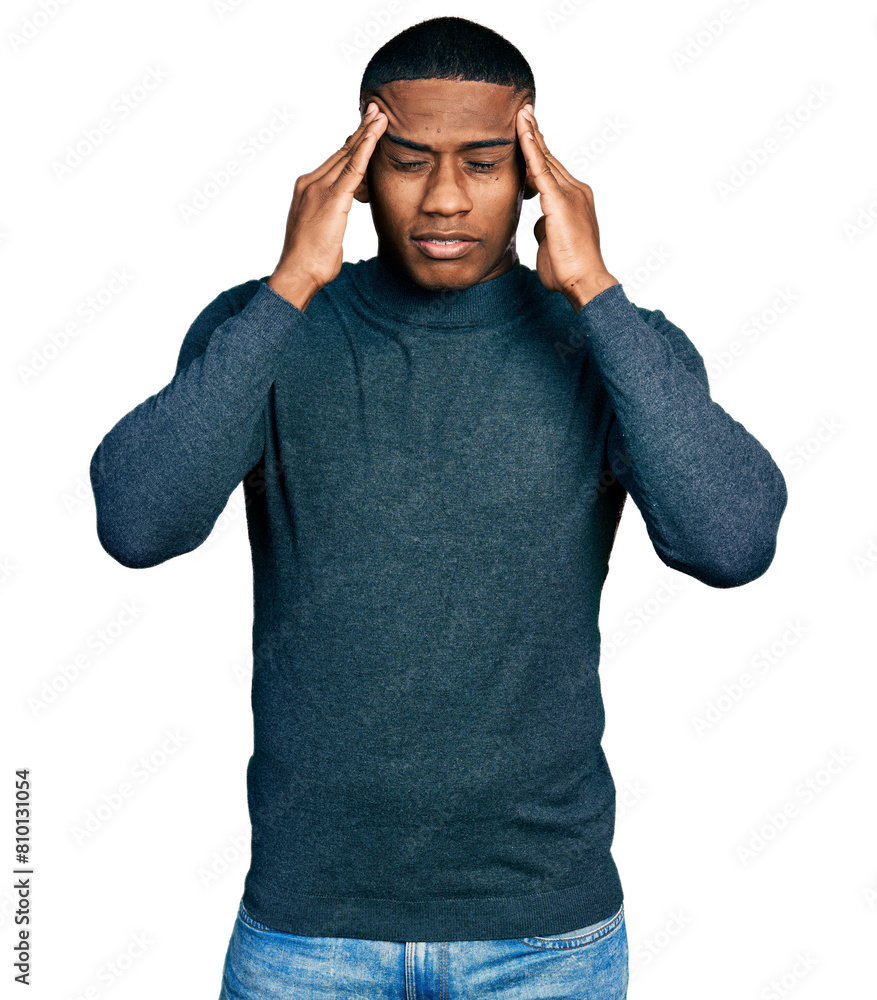 Young black man wearing casual sweater with hand on head, headache because stress. suffering migraine. Young black man wearing casual sweater with hand on head, headache because stress. suffering migraine.