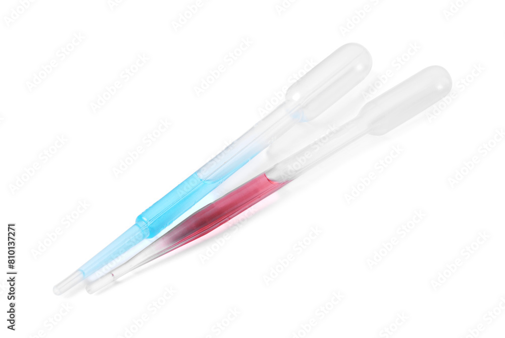 Two transfer pipettes with liquid isolated on white Two transfer pipettes with liquid isolated on white