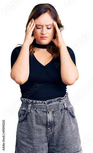 Young beautiful caucasian woman wearing casual clothes suffering from headache desperate and stressed because pain and migraine. hands on head. © Krakenimages.com