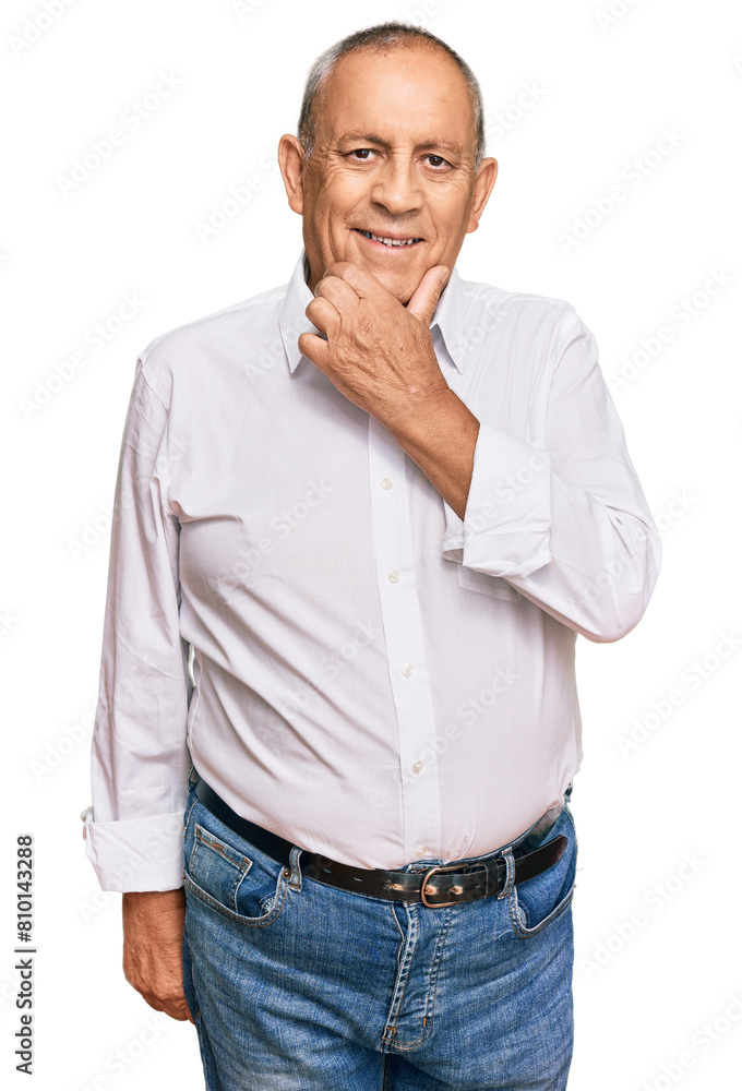 Handsome senior man wearing elegant white shirt looking confident at the camera smiling with crossed arms and hand raised on chin. thinking positive. Handsome senior man wearing elegant white shirt looking confident at the camera smiling with crossed arms and hand raised on chin. thinking positive.