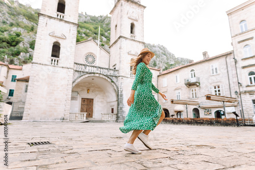 Photography Young woman in beautiful dress walking in the street of the city