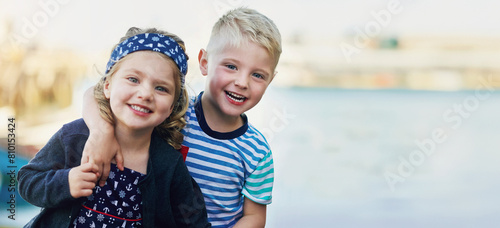 Fotografie Happy, siblings and hug in outdoor for portrait with love, bonding and family, holiday and beach in summer for memory