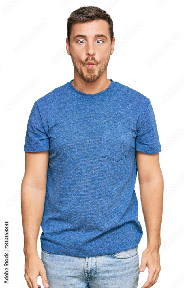 Handsome caucasian man wearing casual clothes making fish face with lips, crazy and comical gesture. funny expression. Handsome caucasian man wearing casual clothes making fish face with lips, crazy and comical gesture. funny expression.