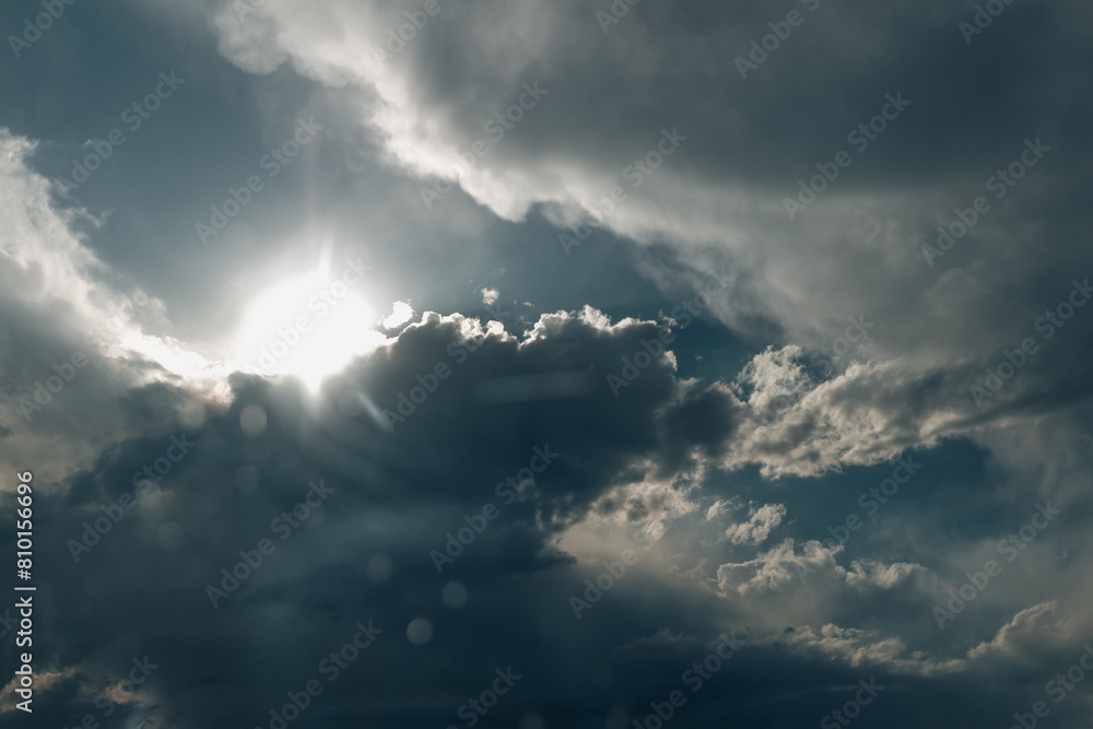 sunlight shining through the clouds in the sky