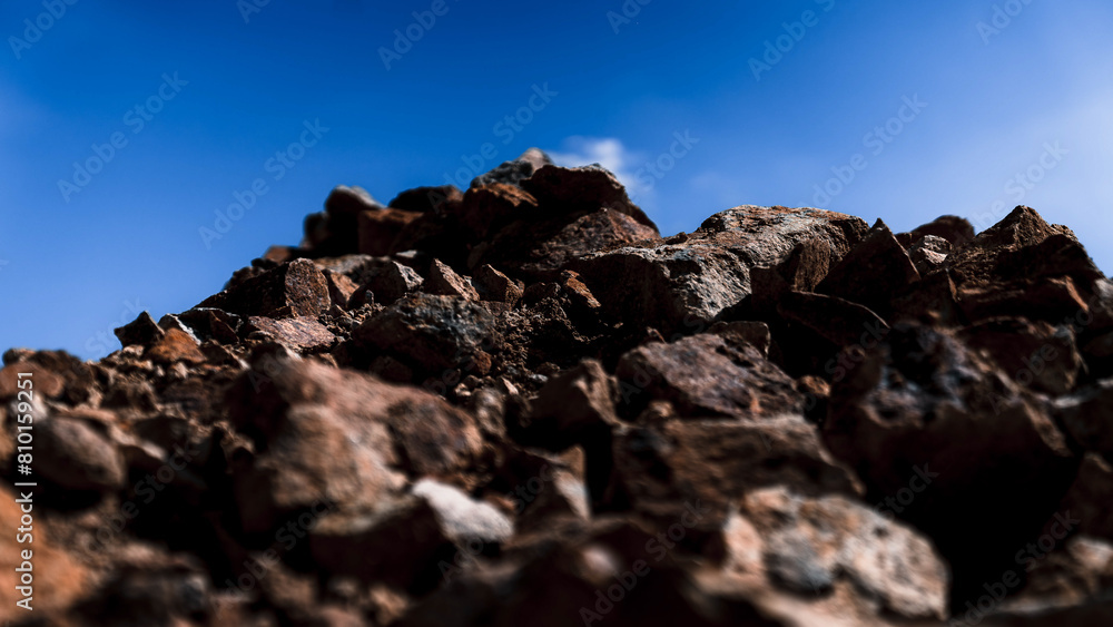 Pile of stones with blue sky background, close-up. Pile of stones with blue sky background, close-up.