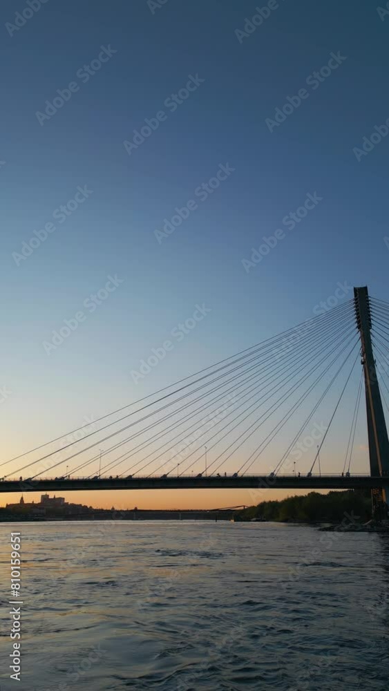 modern cable bridge over Vistula river at sunset, contemporary structures of Warsaw, blue sky on background 4k, vertical video modern cable bridge over Vistula river at sunset, contemporary structures of Warsaw, blue sky on background 4k, vertical video