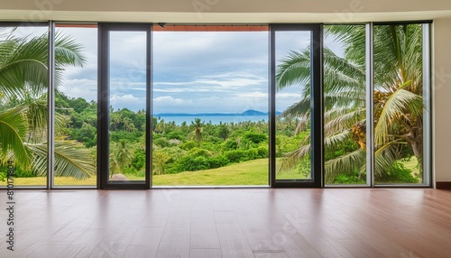 Modern home empty living room interior and panoramic window on tropics