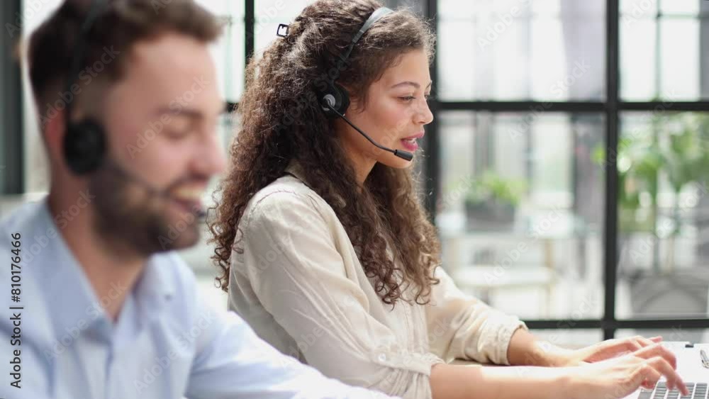 Portrait of beautiful business woman working at her desk with headset and laptop Portrait of beautiful business woman working at her desk with headset and laptop