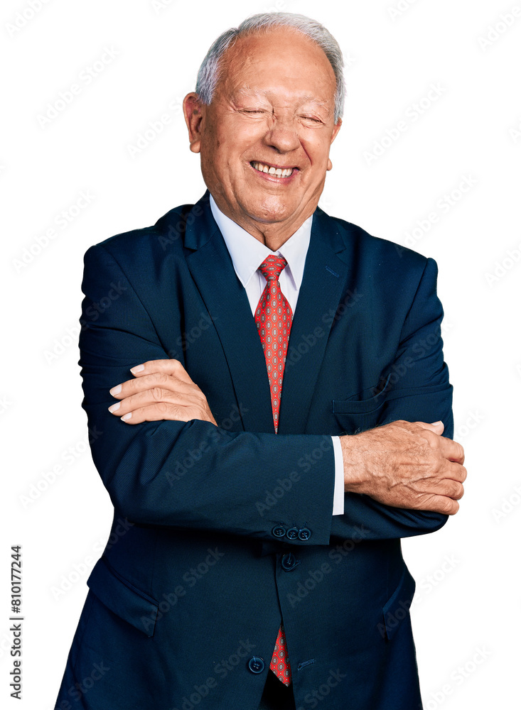 Senior business man with grey hair with arms crossed gesture winking looking at the camera with sexy expression, cheerful and happy face. Senior business man with grey hair with arms crossed gesture winking looking at the camera with sexy expression, cheerful and happy face.