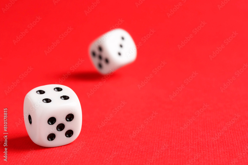 Many white game dices falling on red background. Space for text Many white game dices falling on red background. Space for text
