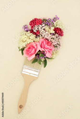 Surreal painting with summer flowers and herbs with paintbrush. Natural alternative adaptogen tranquilizing floral ingredients used in herbal medicine treatments on hemp paper.