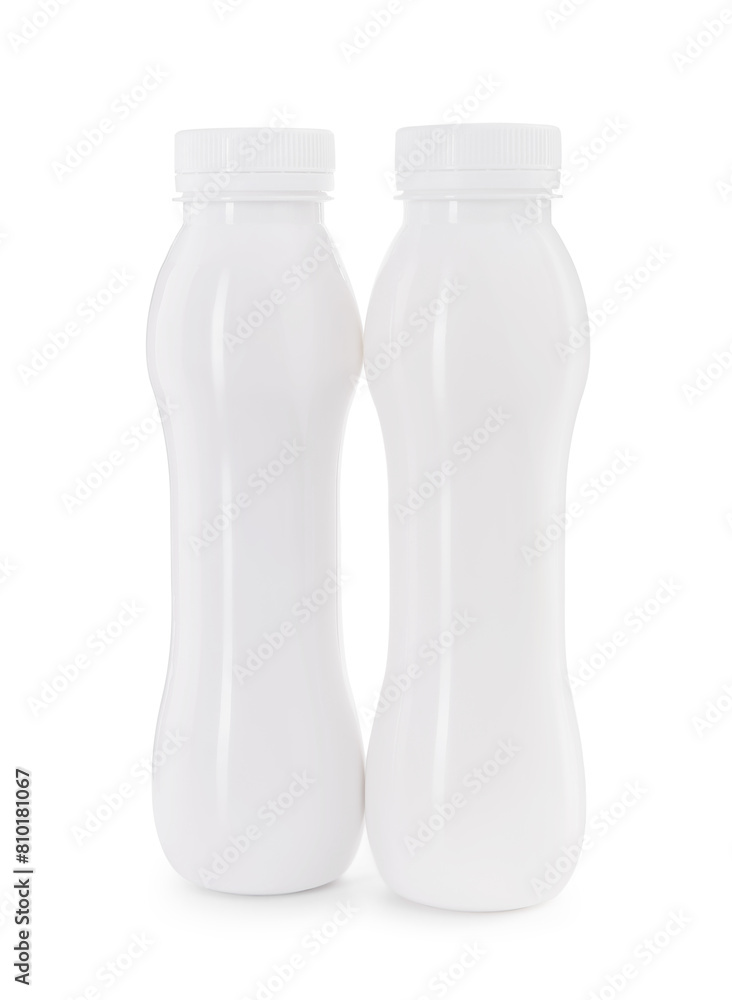 Tasty yogurt in bottles isolated on white Tasty yogurt in bottles isolated on white