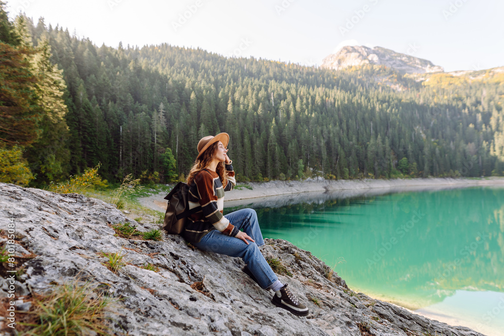 Outdoor picture of woman having vacation,  posing near forest and mountains, casual outfit. Active life. Lifestyle, travel, tourism