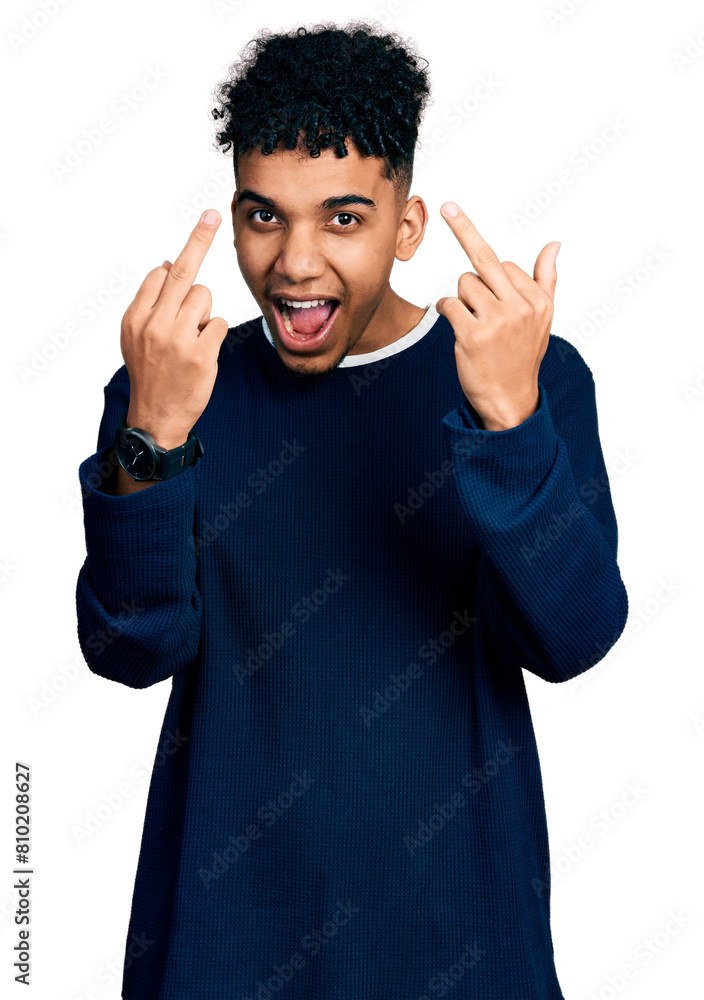 Young african american man wearing casual clothes showing middle finger doing fuck you bad expression, provocation and rude attitude. screaming excited Young african american man wearing casual clothes showing middle finger doing fuck you bad expression, provocation and rude attitude. screaming excited