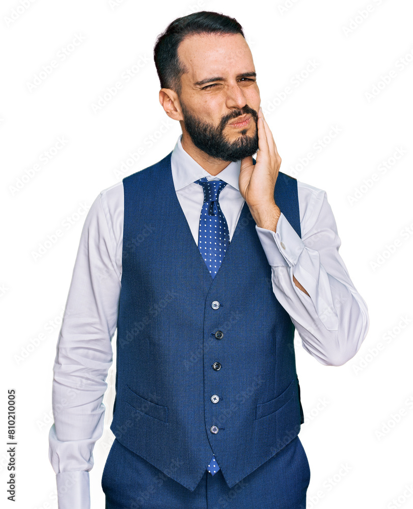 Young man with beard wearing business vest touching mouth with hand with painful expression because of toothache or dental illness on teeth. dentist Young man with beard wearing business vest touching mouth with hand with painful expression because of toothache or dental illness on teeth. dentist