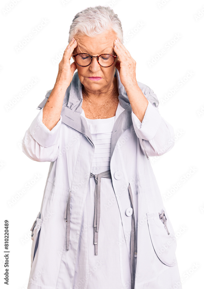 Senior beautiful woman with blue eyes and grey hair wearing casual clothes and glasses with hand on head for pain in head because stress. suffering migraine. Senior beautiful woman with blue eyes and grey hair wearing casual clothes and glasses with hand on head for pain in head because stress. suffering migraine.
