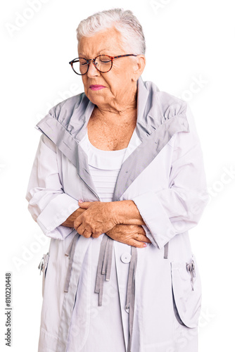 Senior beautiful woman with blue eyes and grey hair wearing casual clothes and glasses with hand on stomach because nausea, painful disease feeling unwell. ache concept.