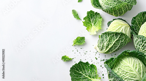 Pieces of fresh savoy cabbage on white background