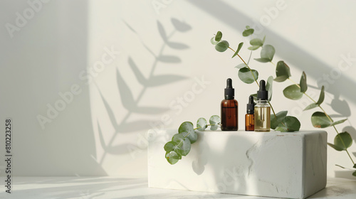 Plaster podium with bottles of essential oil