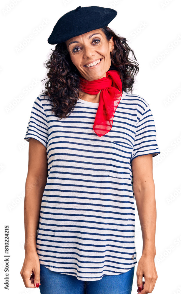 Middle age beautiful woman wearing french beret and scarf looking positive and happy standing and smiling with a confident smile showing teeth Middle age beautiful woman wearing french beret and scarf looking positive and happy standing and smiling with a confident smile showing teeth