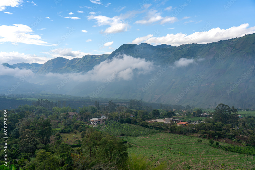 Valley with crops and houses between mountains in the morning in a Colombian landscape