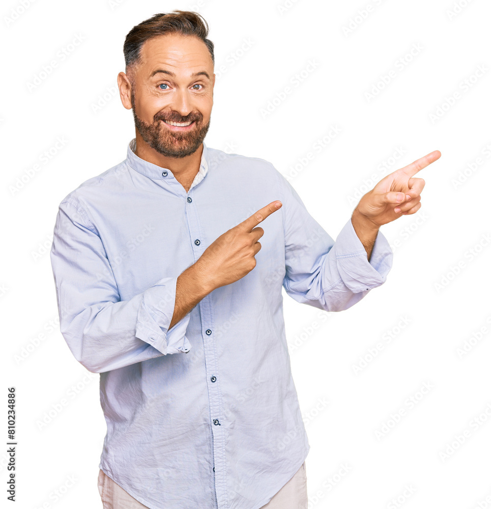 Handsome middle age man wearing business shirt smiling and looking at the camera pointing with two hands and fingers to the side. Handsome middle age man wearing business shirt smiling and looking at the camera pointing with two hands and fingers to the side.