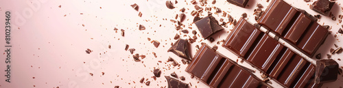  chocolate bar banner with copy space, background is a soft pink color, chocolate dust in the air, product photography