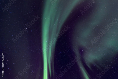 aurora borealis in green and purple as background 