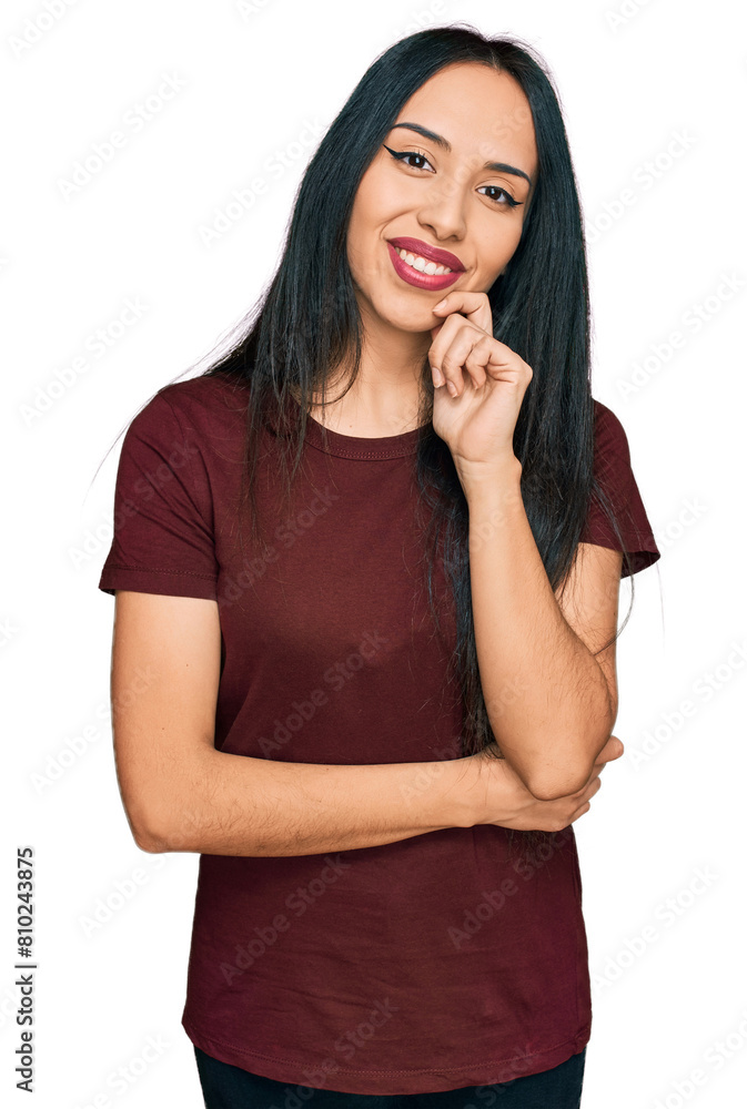 Young hispanic girl wearing casual t shirt looking confident at the camera with smile with crossed arms and hand raised on chin. thinking positive. Young hispanic girl wearing casual t shirt looking confident at the camera with smile with crossed arms and hand raised on chin. thinking positive.