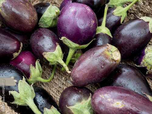 purple eggplants in a farmers market stall