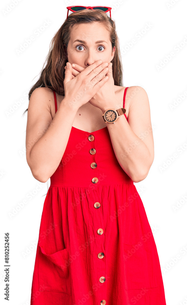 Young beautiful blonde woman wearing casual dress shocked covering mouth with hands for mistake. secret concept. Young beautiful blonde woman wearing casual dress shocked covering mouth with hands for mistake. secret concept.