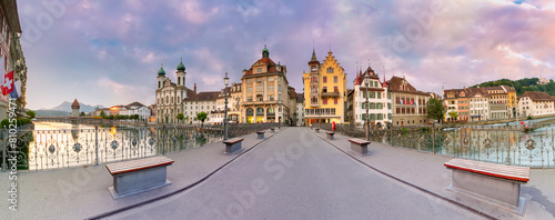 Panorama Reussbrucke bridge at sunrise with Jesuit Church in Old Town of Lucerne, Switzerland