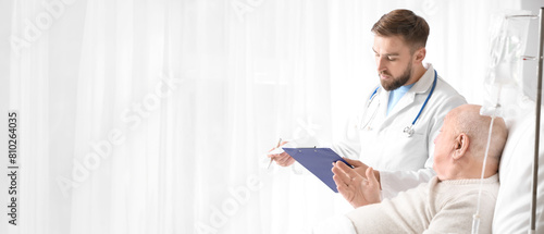 Doctor and senior man under...