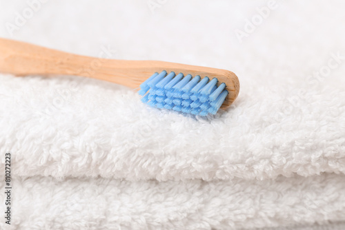 Toothbrush on white clean towel  closeup