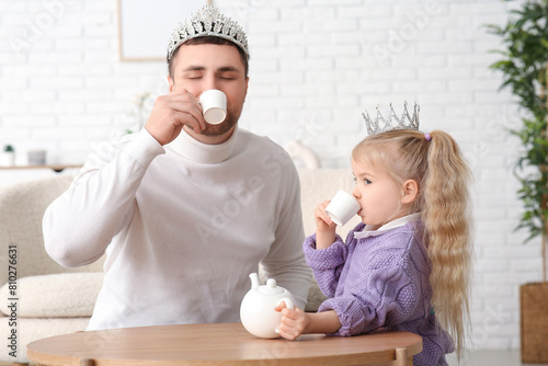 Happy father with his cute ...
