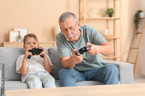 Grandfather with his cute l...