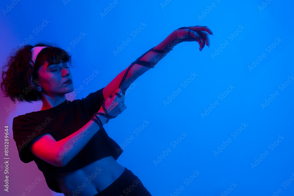 Sporty young woman stretching and doing yoga exercises. Young woman doing dance figures on white background Sporty young woman stretching and doing yoga exercises. Young woman doing dance figures on white background
